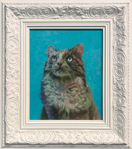 Cat painting in a decorative white frame on a blue background