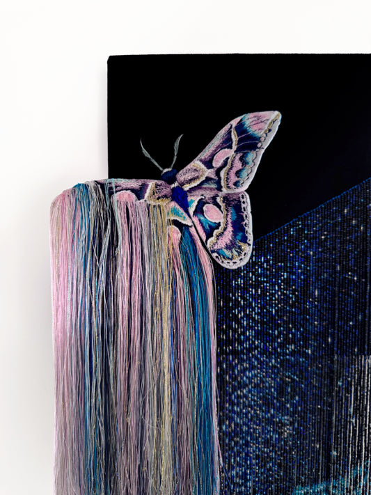 Decorative mixed media wall art with a butterfly and nebula exploding