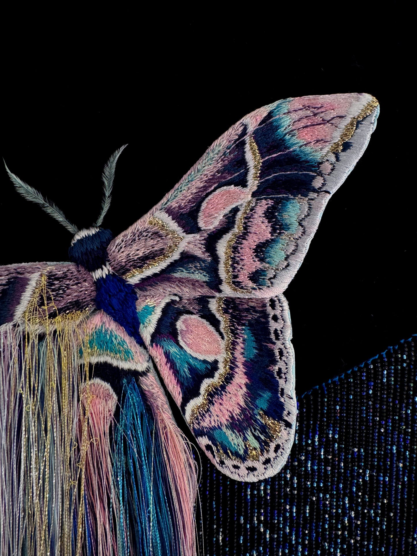 Decorative mixed media wall art with a butterfly and nebula exploding