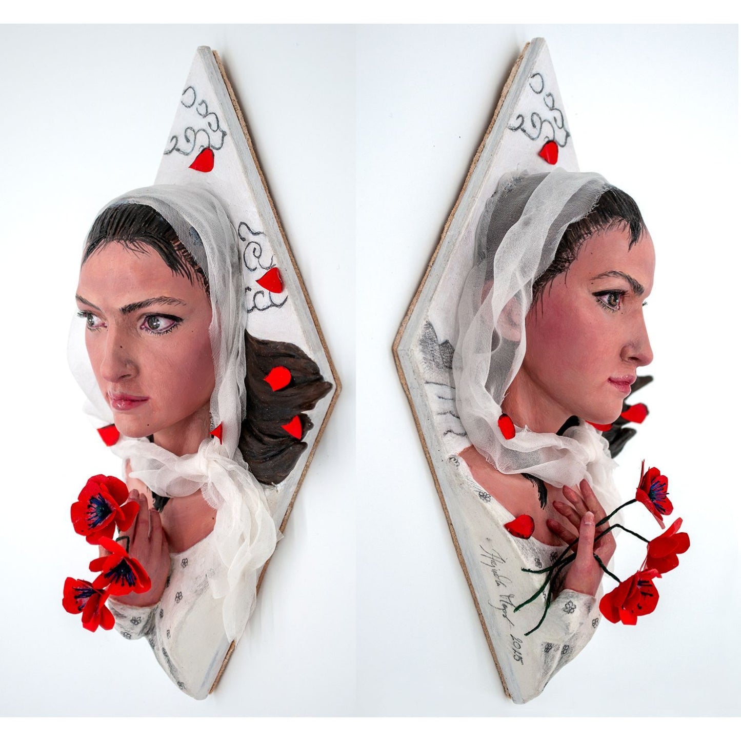 Realistic mixed media sculpture of a woman in white surrounded by poppies