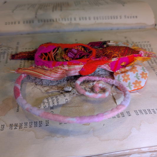 Squashed taxidermy mouse in an open book