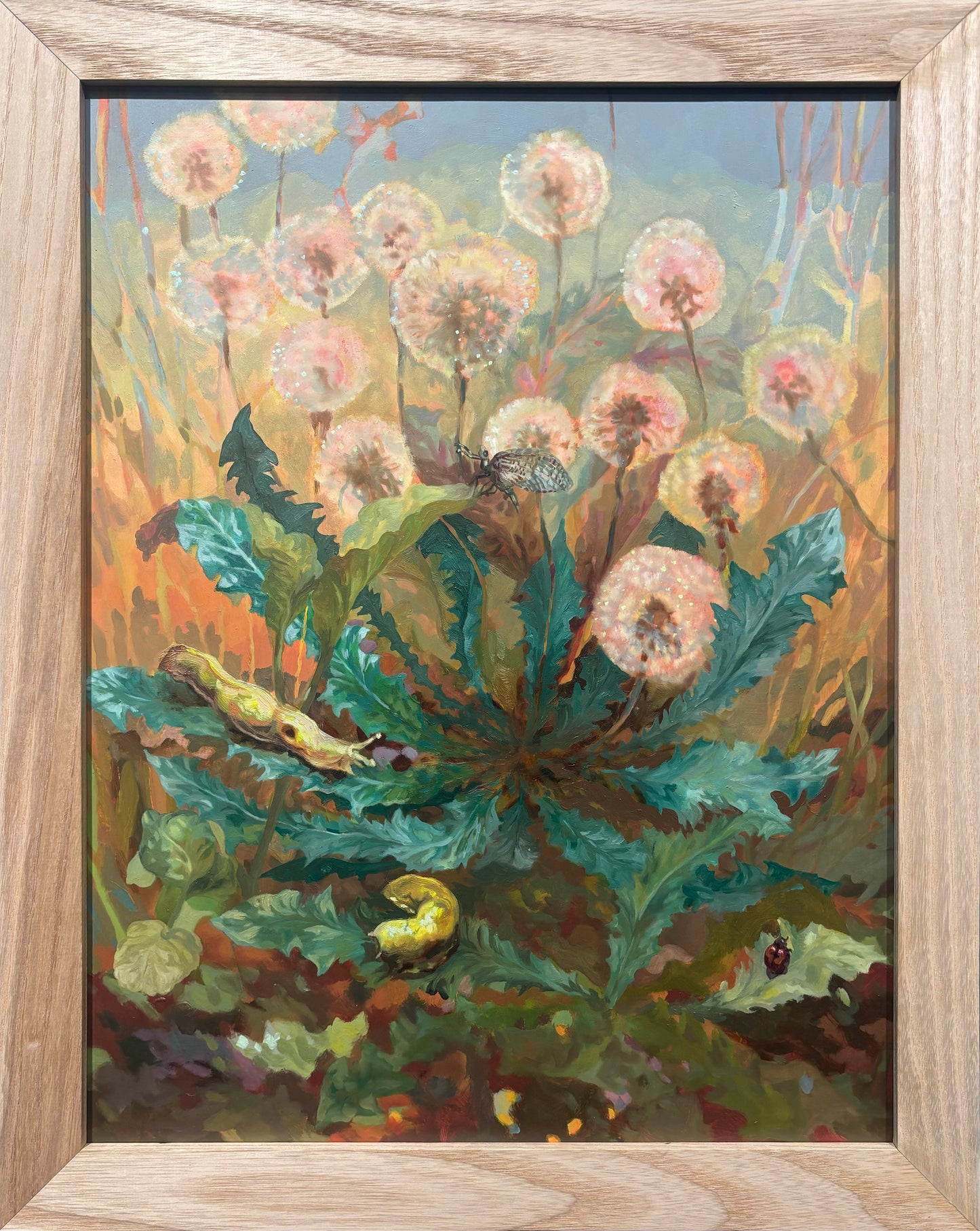 Framed painting of dandelions with a butterfly and caterpillars.