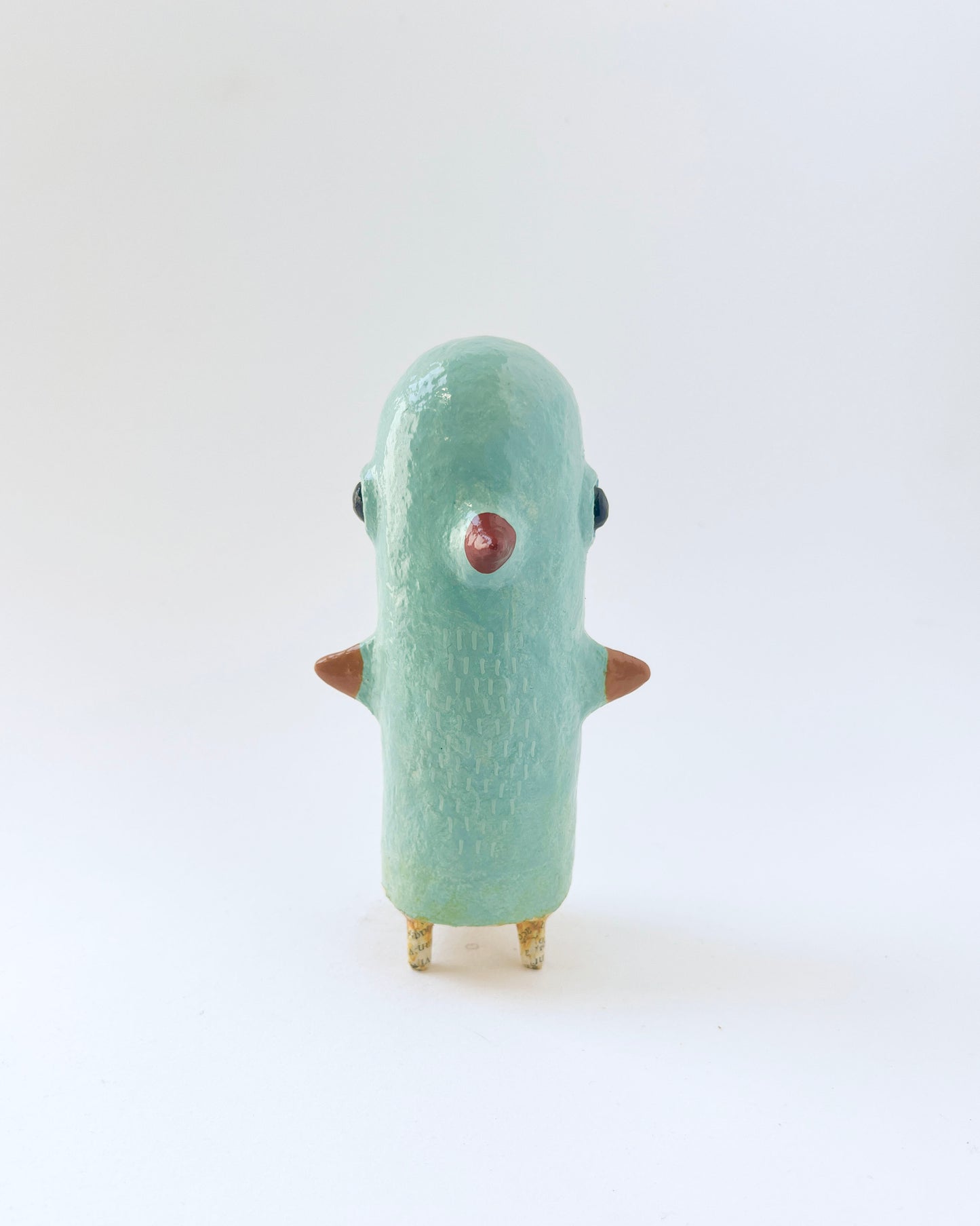 Paper mache bird like creature with a surrealist twist