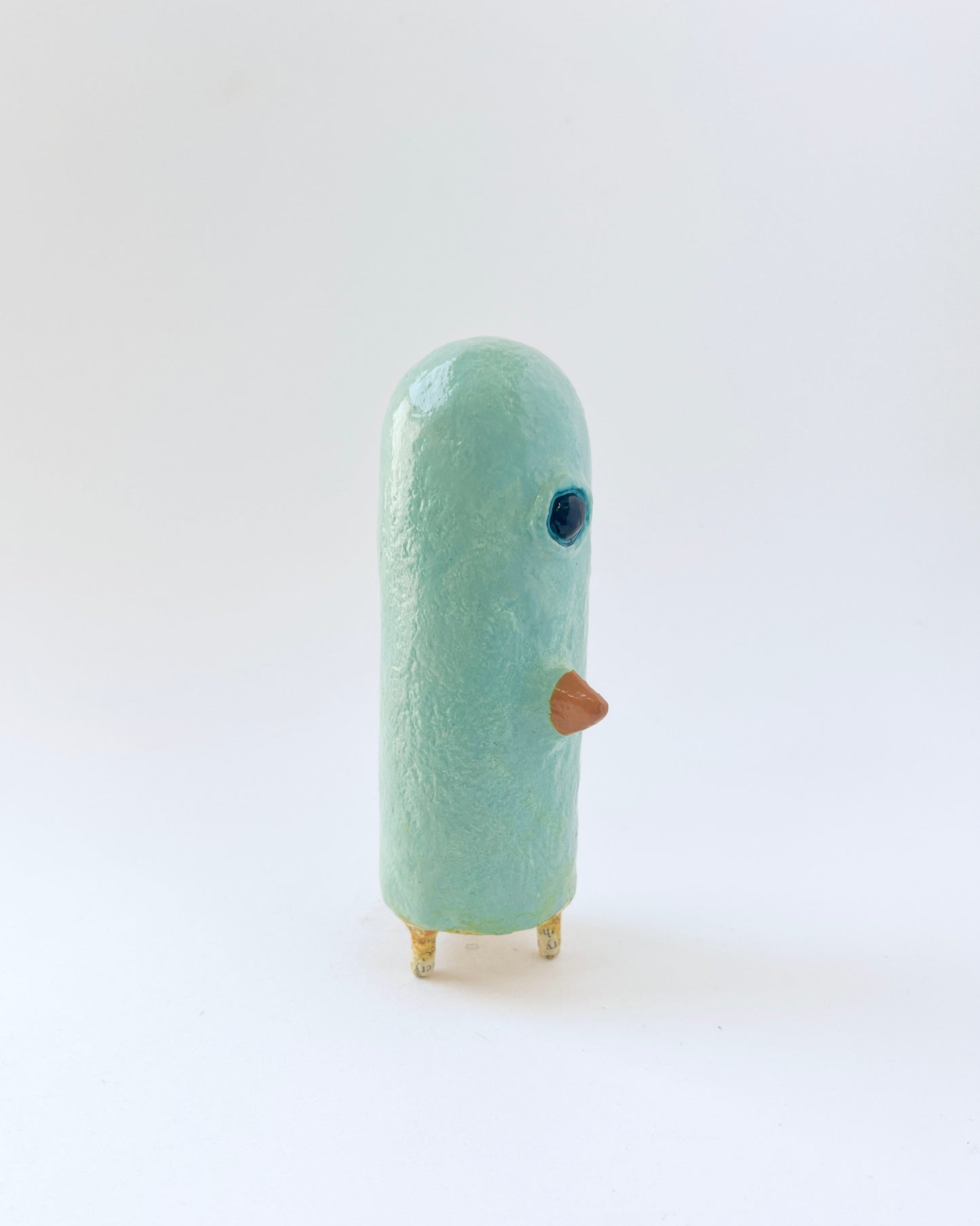 Paper mache bird like creature with a surrealist twist