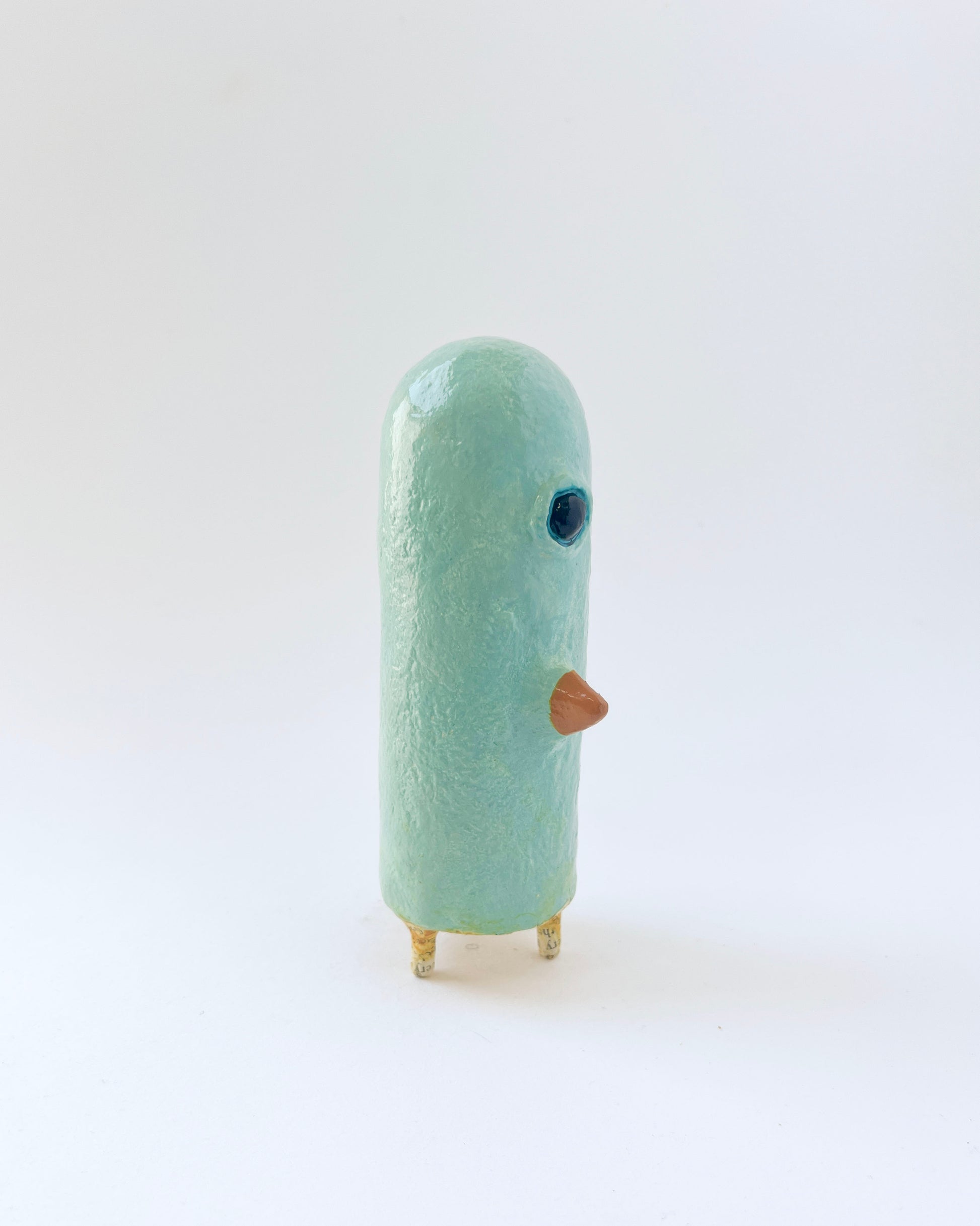Paper mache bird like creature with a surrealist twist