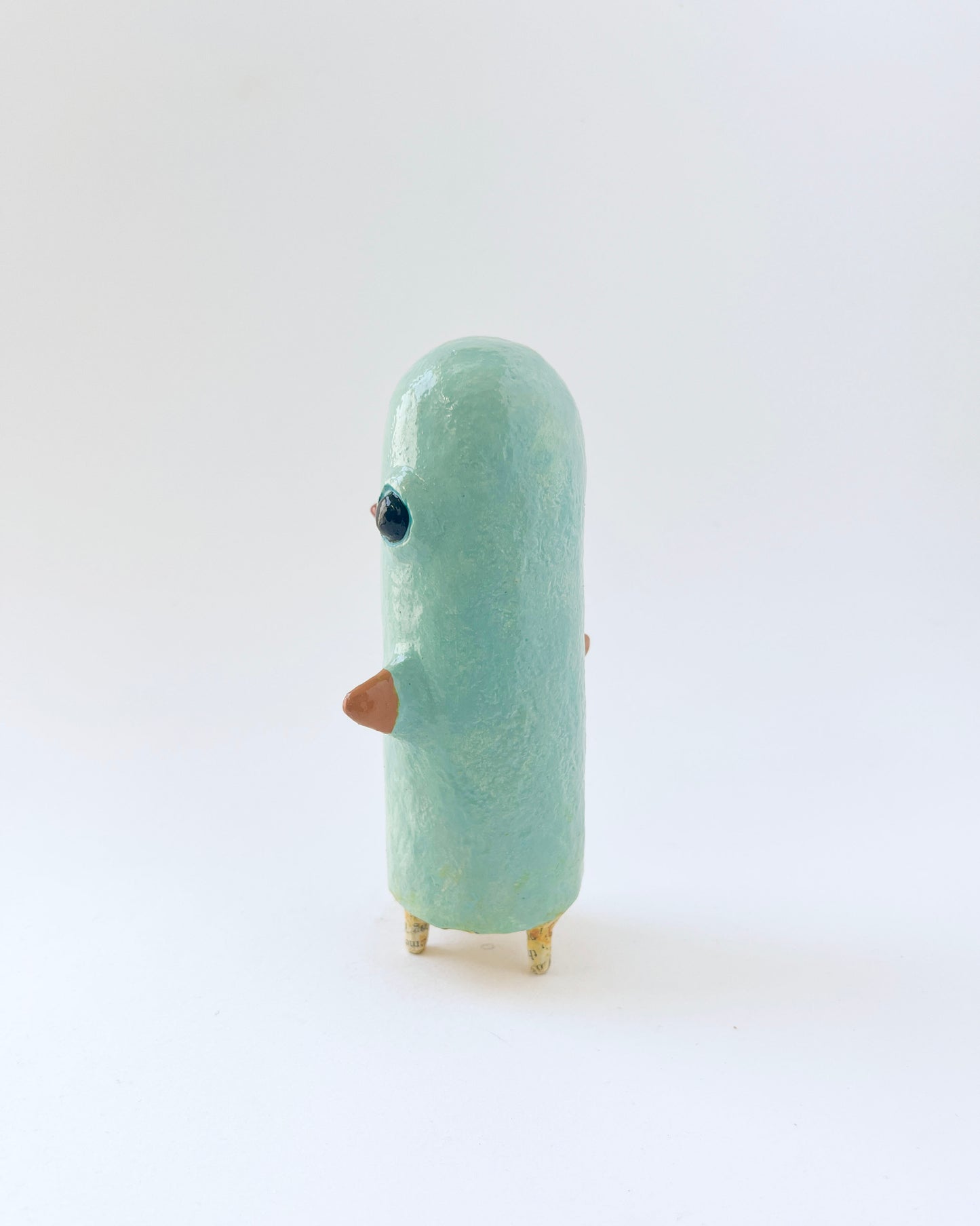 Paper mache bird like creature with a surrealist twist