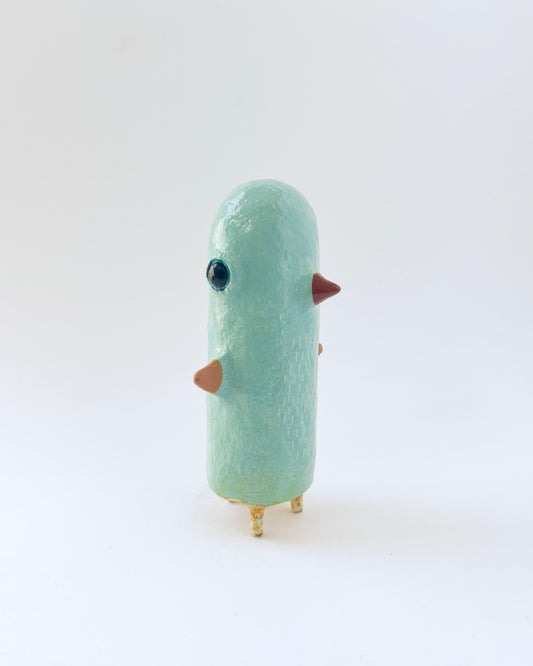 Paper mache bird like creature with a surrealist twist