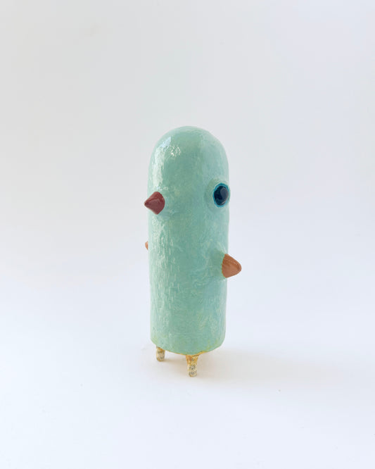 Paper mache bird like creature with a surrealist twist