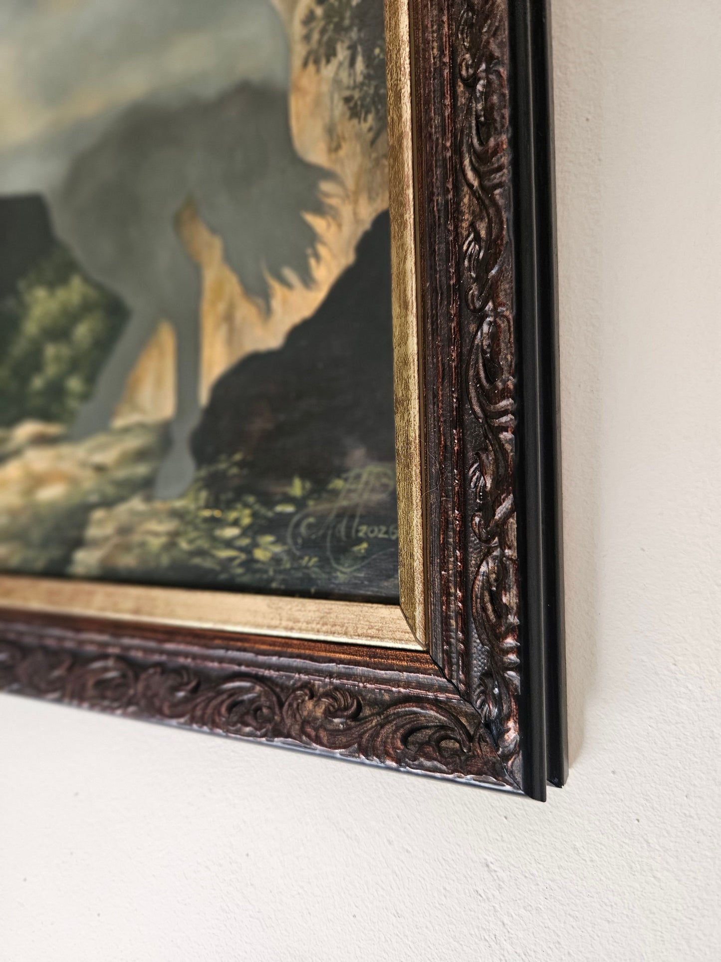 Close-up of a framed oil painting of a rearing unicorn in moonlight by Andrea du Plessis
