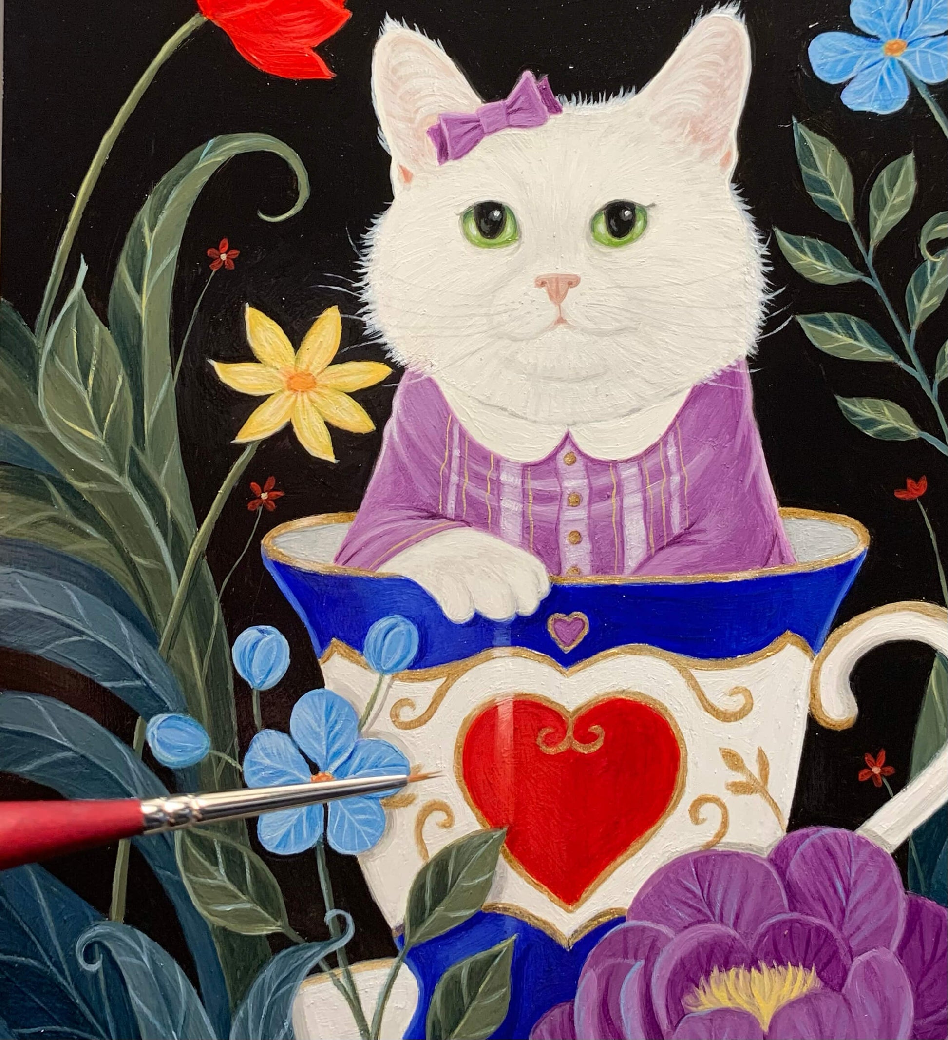 A whimsical painting of a white cat wearing a purple dress and bow, sitting inside a large blue and white teacup with a red heart on the front, surrounded by colorful flowers on a black background.