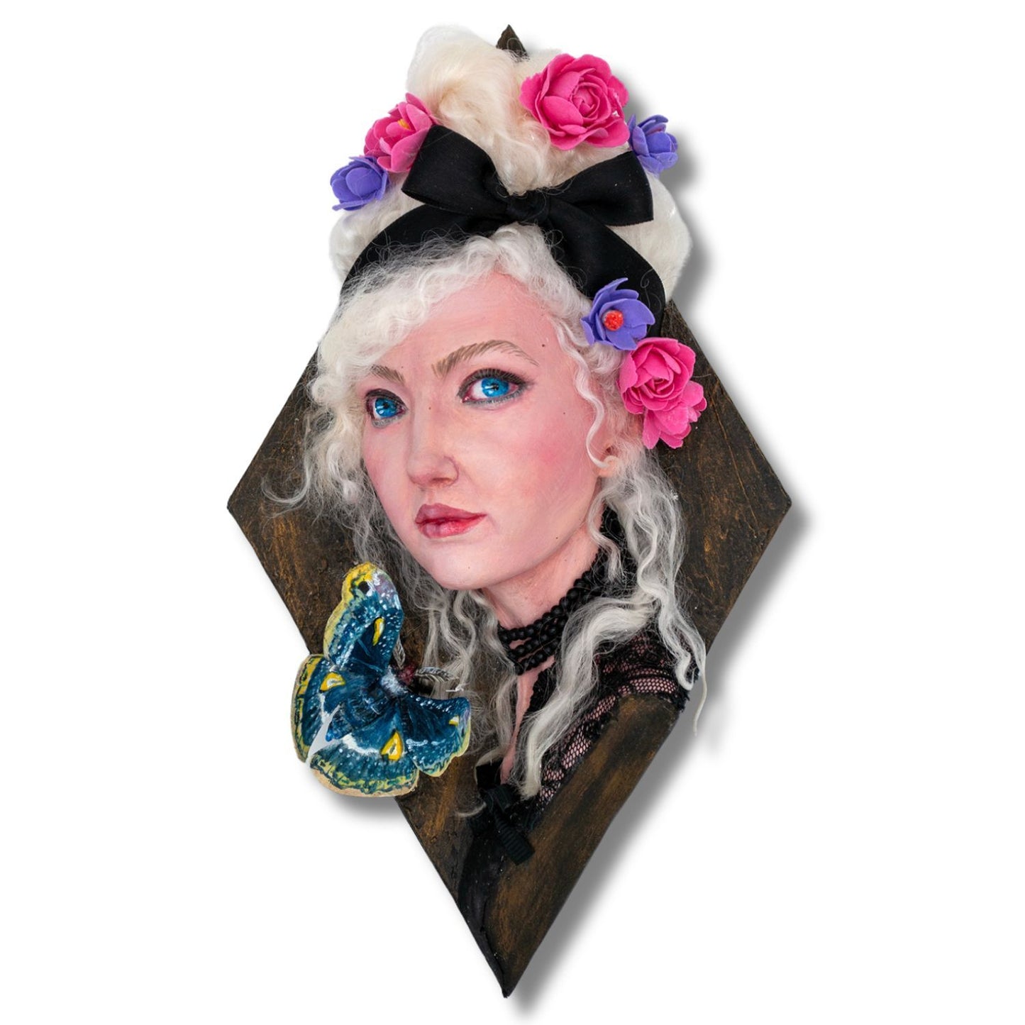 Airdry clay and mixed media sculpture of a woman with a moth