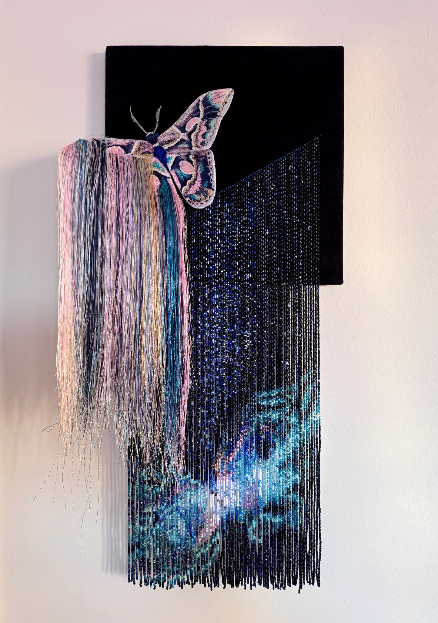 Decorative mixed media wall art with a butterfly and nebula exploding