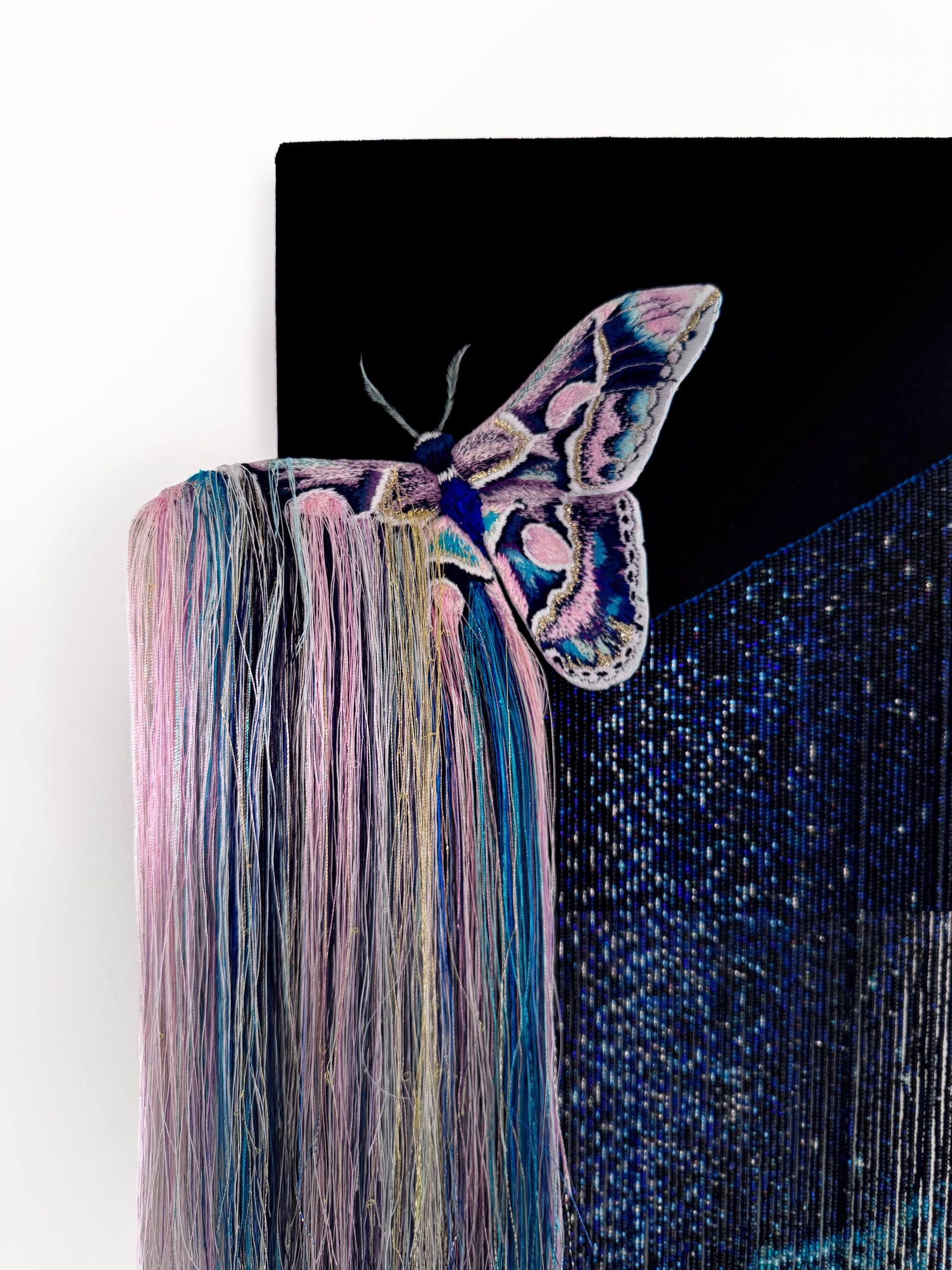 Decorative mixed media wall art with a butterfly and nebula exploding