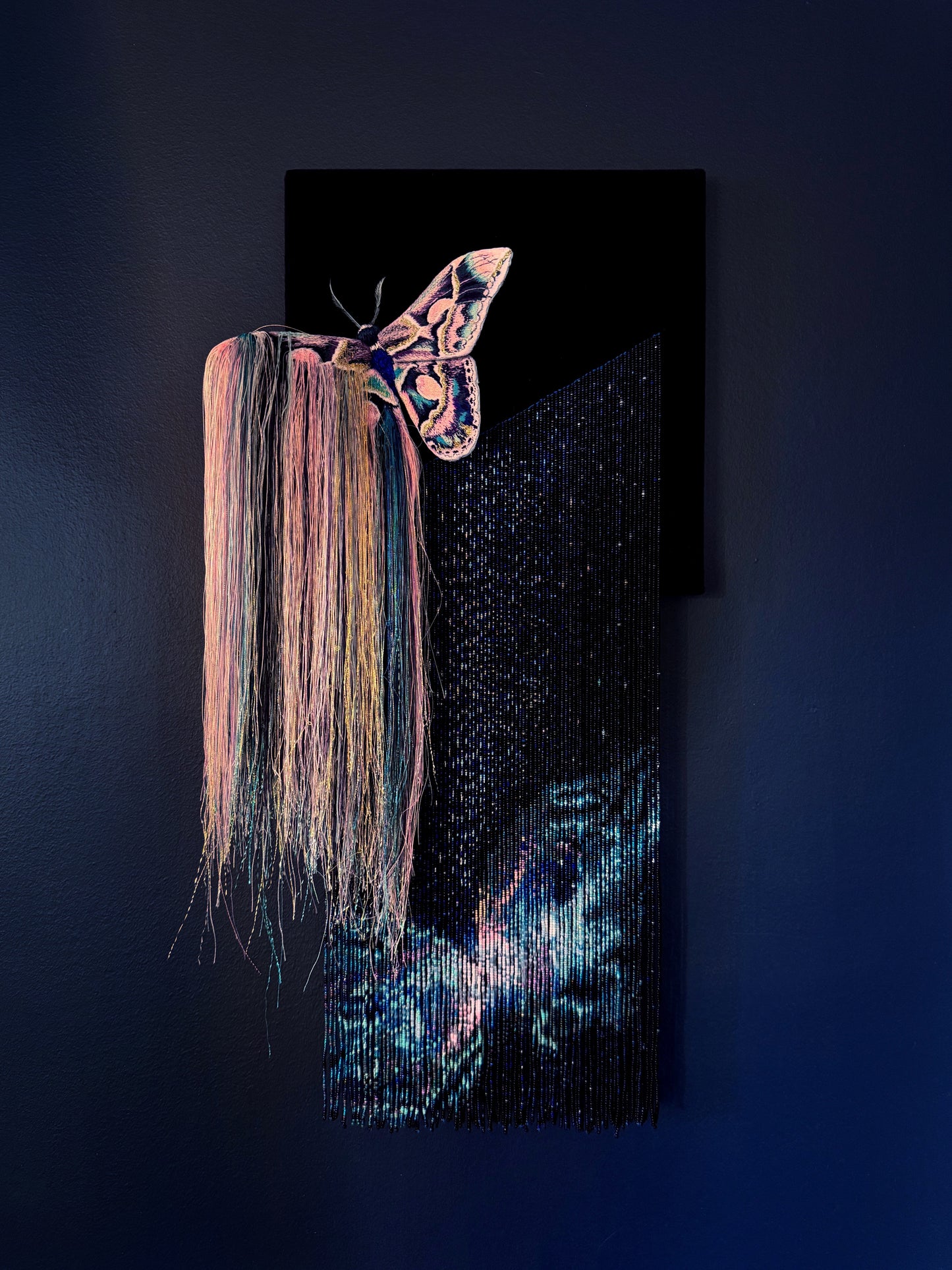 Decorative mixed media wall art with a butterfly and nebula exploding