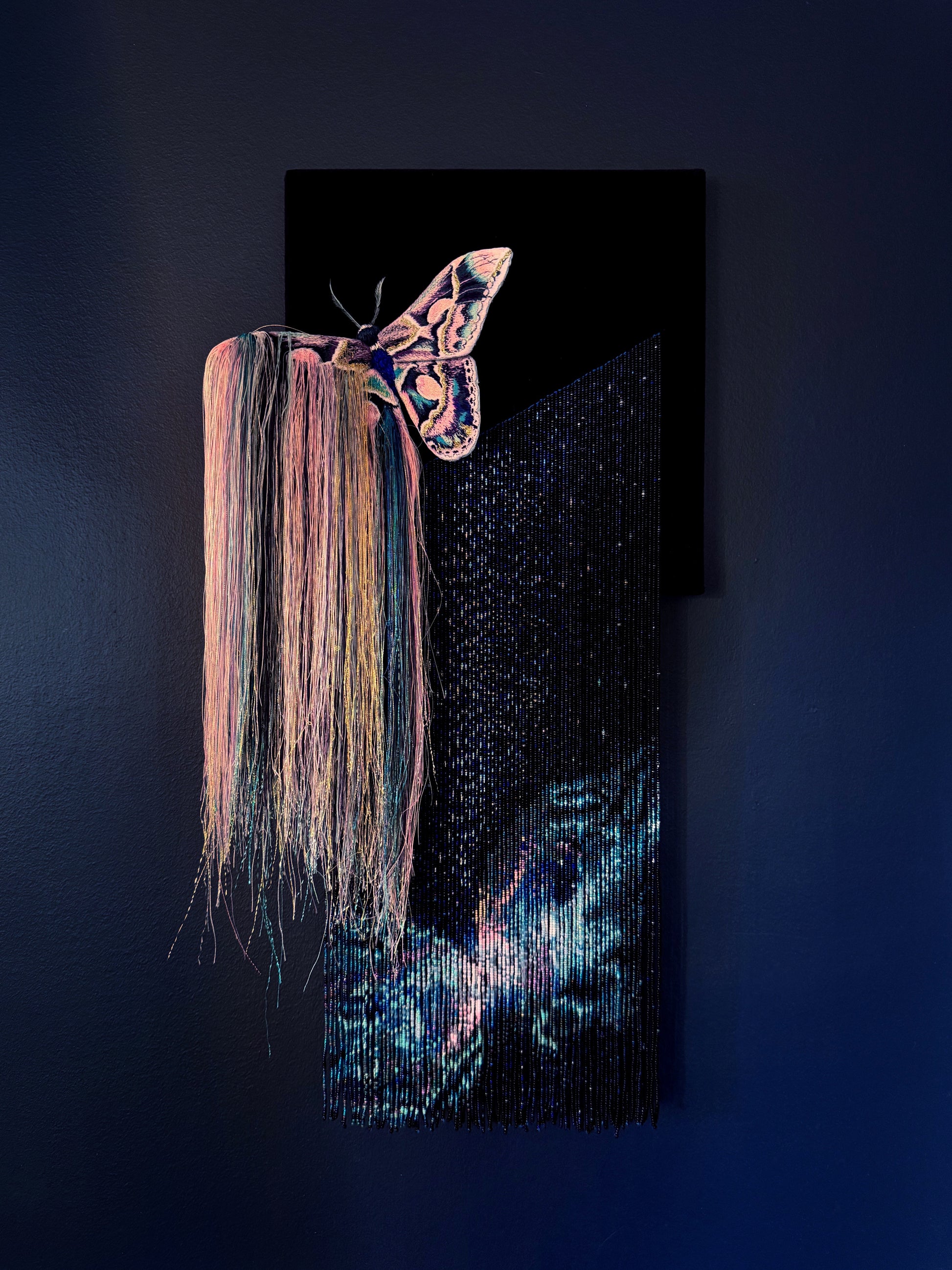 Decorative mixed media wall art with a butterfly and nebula exploding