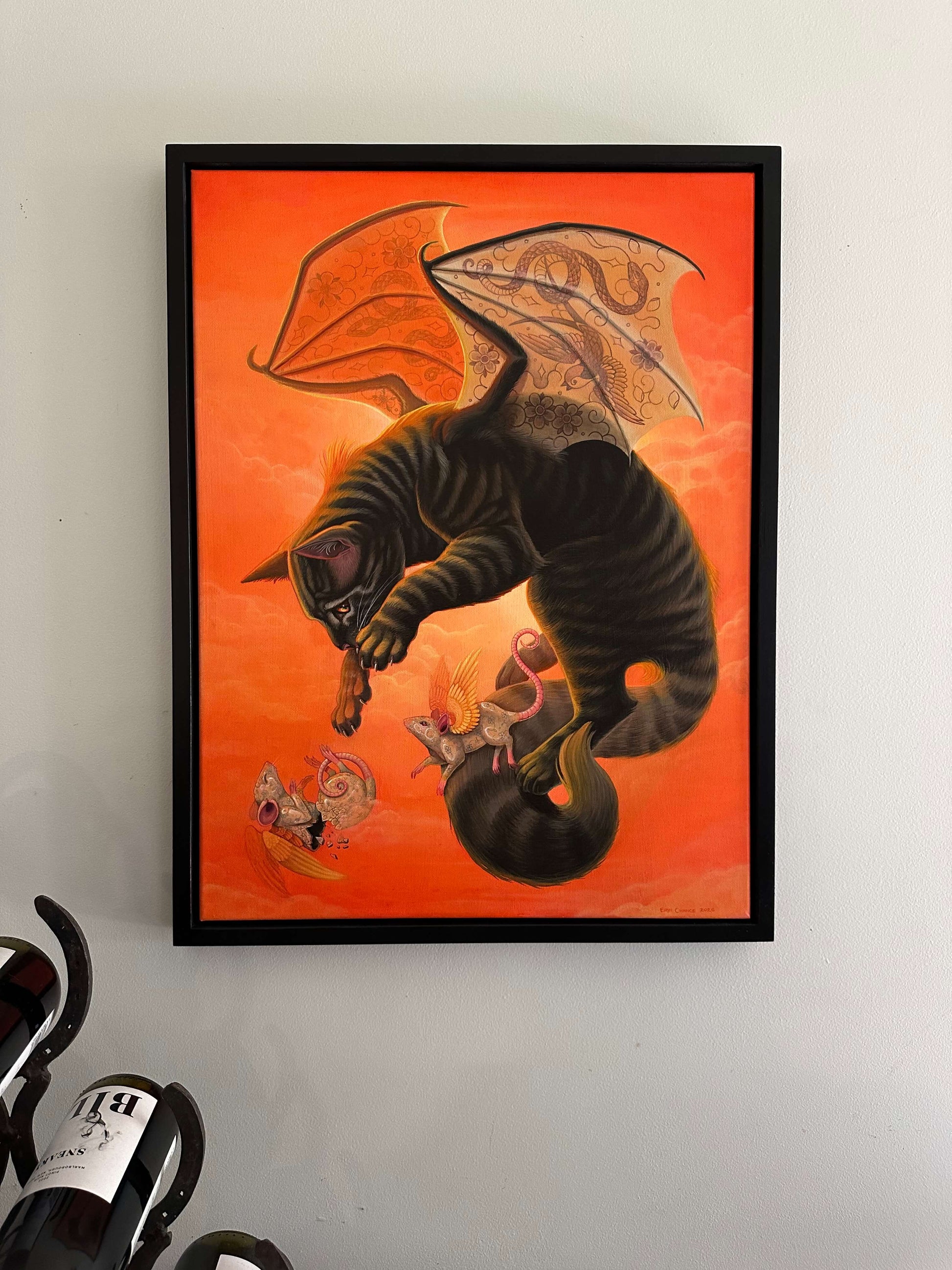Erin Chance’s fantasy acrylic painting features a cat with wings flying with his or her winged rodent companions.