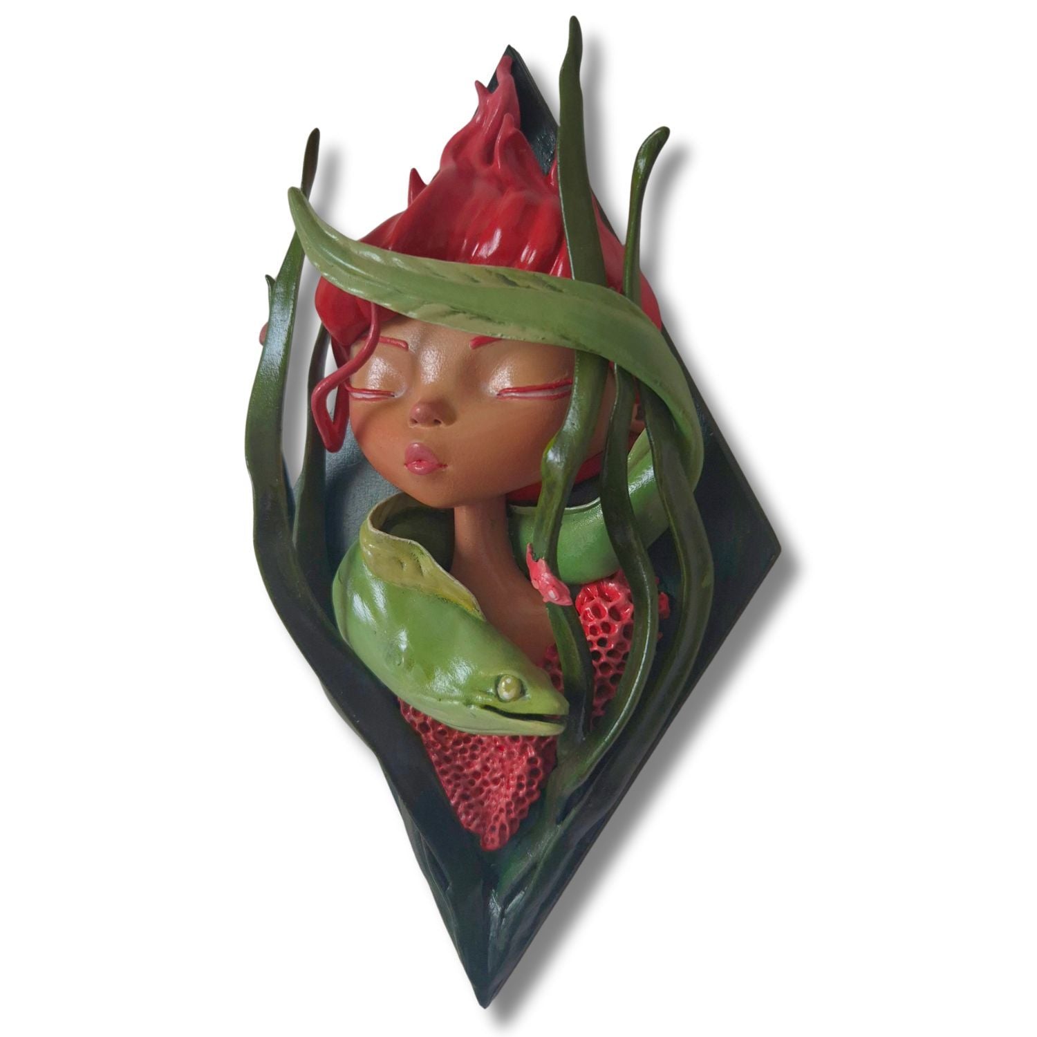 Decorative wall piece with a stylized face surrounded kelp and a sea eel