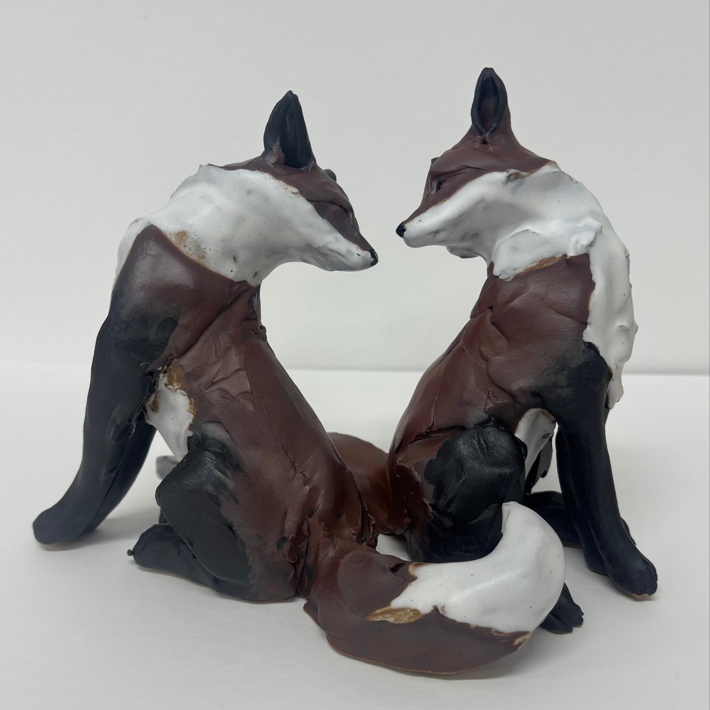 Ceramic duo of foxes by Kylie Matheson