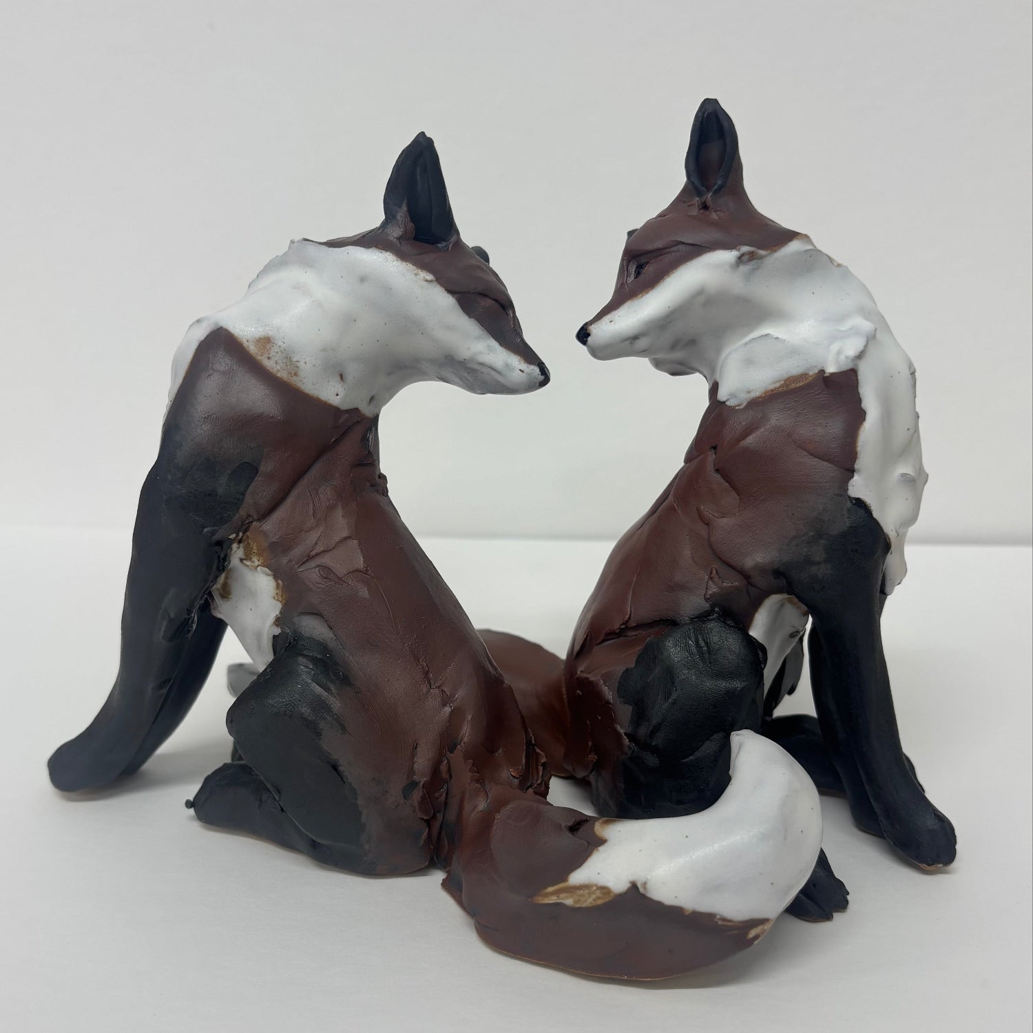 Ceramic duo of foxes by Kylie Matheson