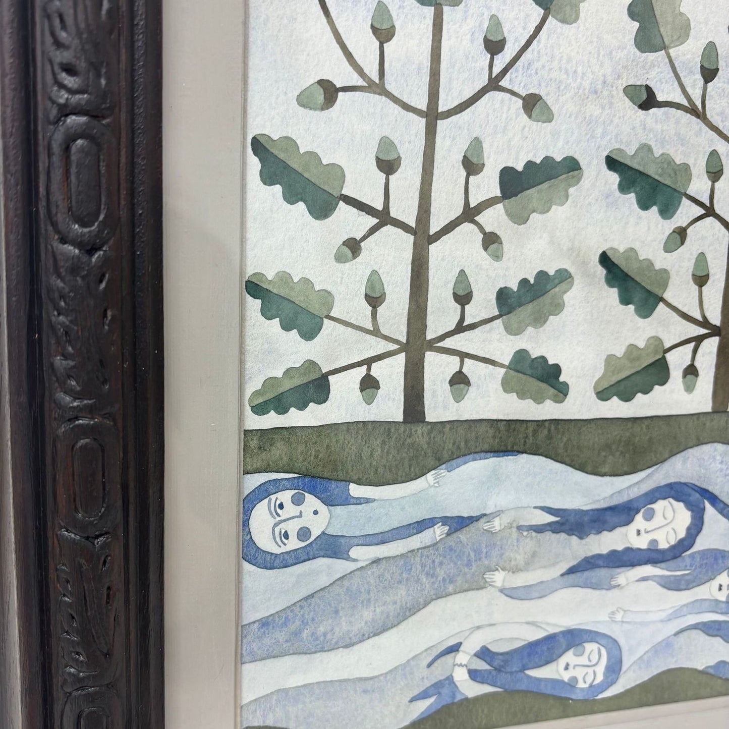 Framed artwork of trees, spirits and water.