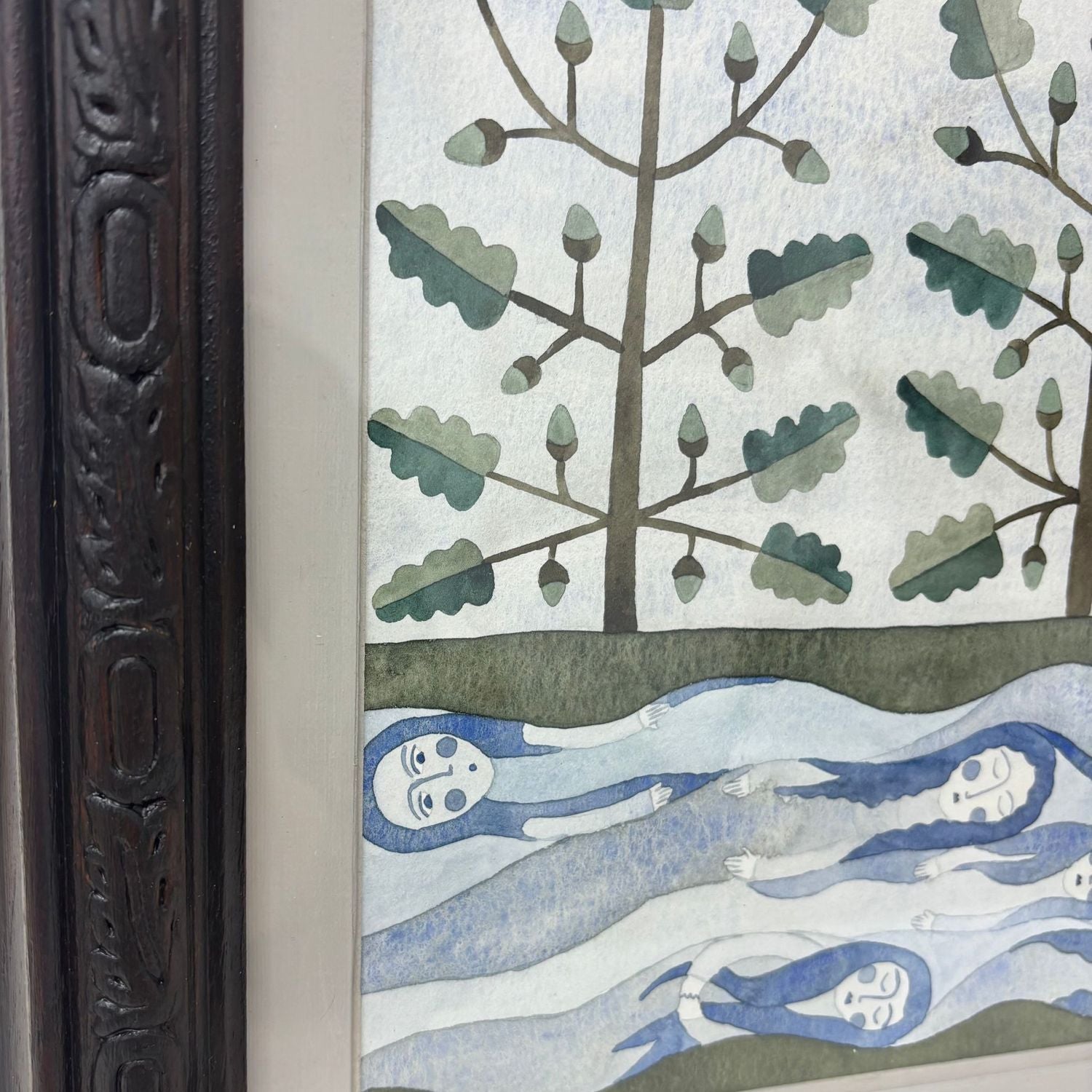 Framed artwork of trees, spirits and water.