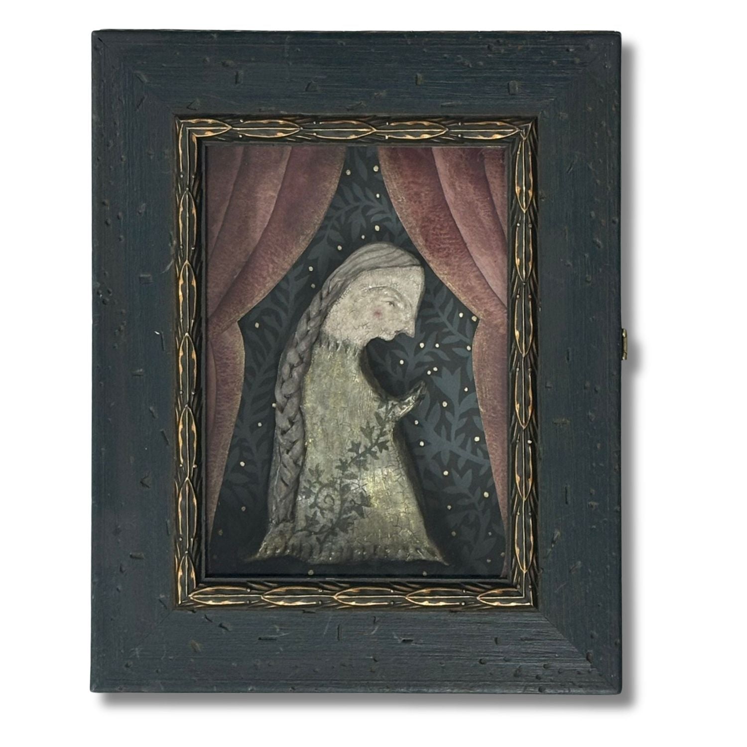 Diorama artwork featuring a women holding a rosary made of ivy