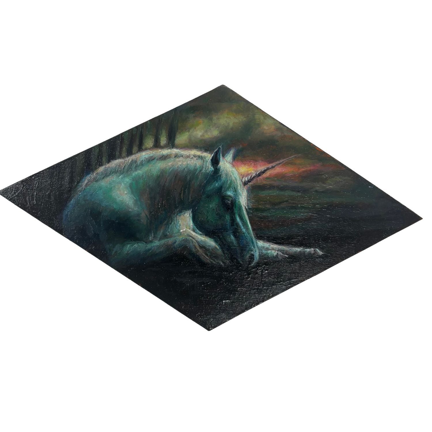 Painting of a unicorn laying down against a bleak background on a diamond shaped panel