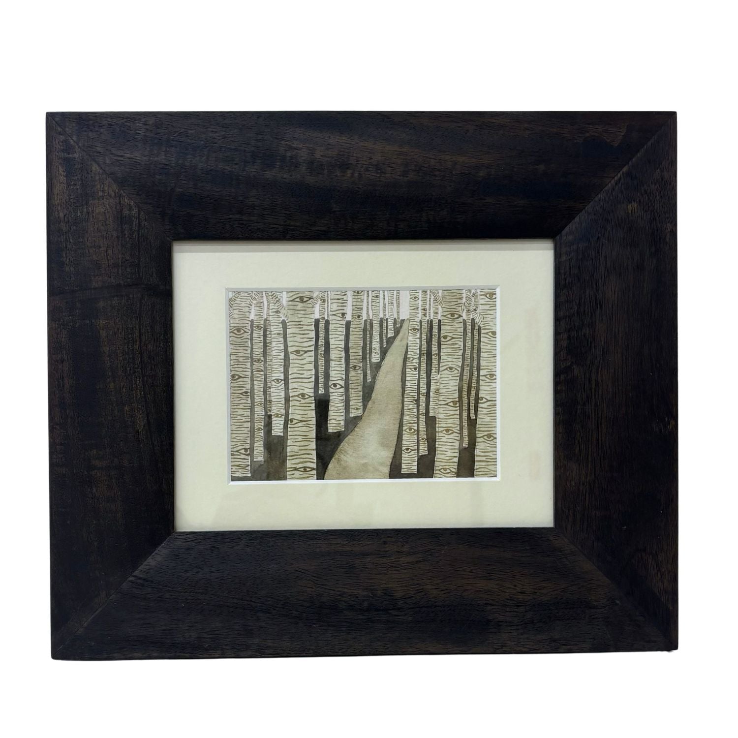 Framed artwork of a forest fill of trees watching the viewer