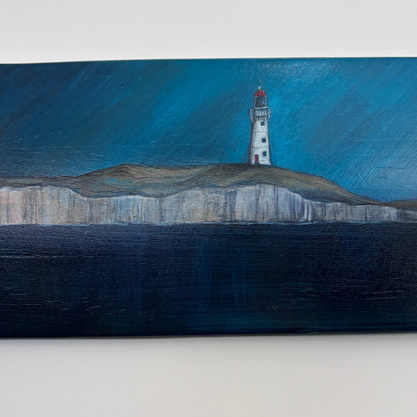 Oar with acrylic and pencil scene of a lighthouse and whales