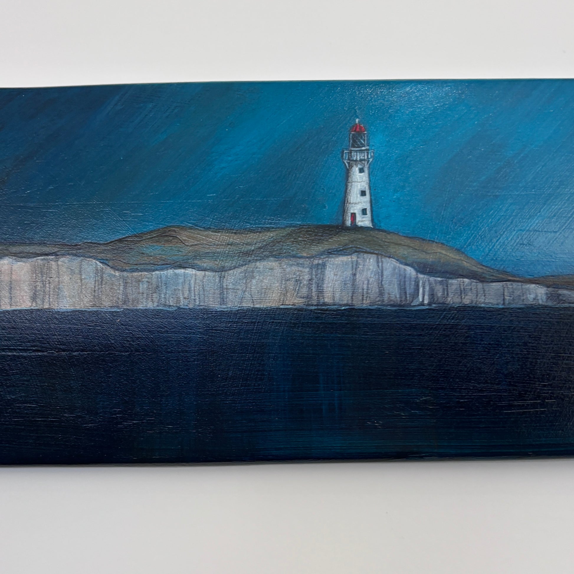 Oar with acrylic and pencil scene of a lighthouse and whales
