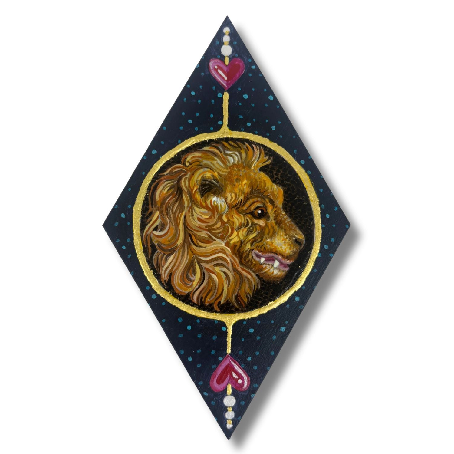 Decorative wall art with a lion's head and heart design on a dark background