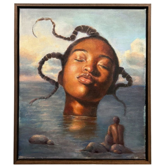 Framed artwork of a woman's face emerging from water with braided hair, set against a sky and ocean background.