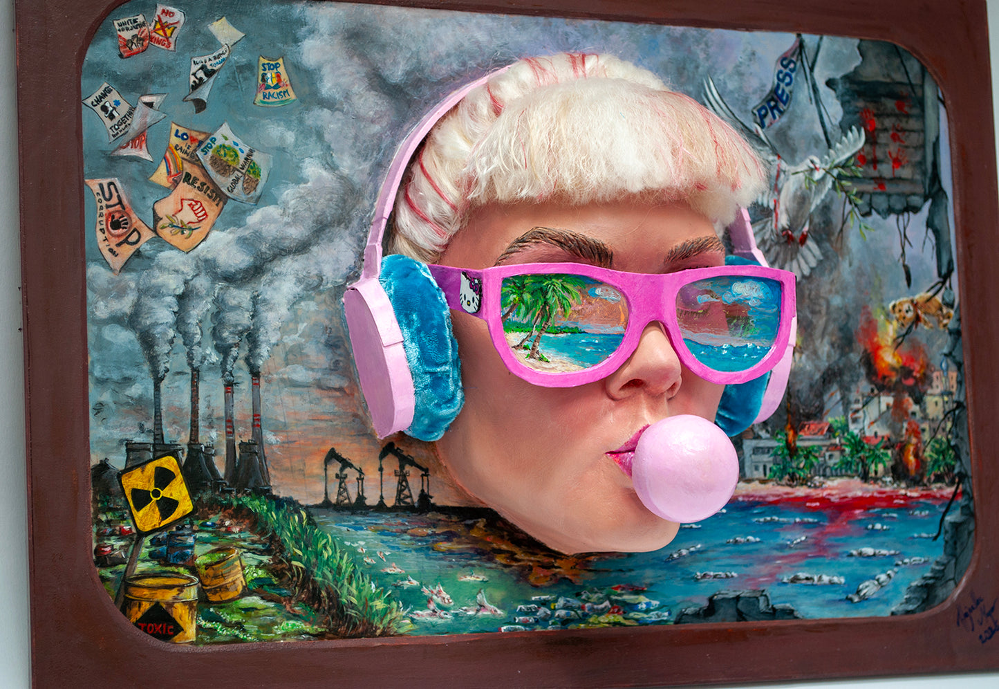 Sculptural wall art featuring  a sunglass and headphone wearing girl blowing bubble gum, surrounded by colorful and chaotic elements.