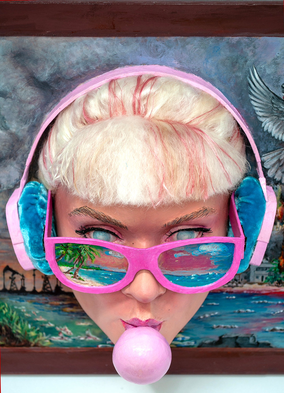 Sculptural wall art featuring  a sunglass and headphone wearing girl blowing bubble gum, surrounded by colorful and chaotic elements.